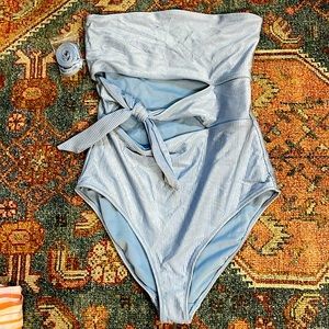 NWOT Light blue metallic one piece cutout swimsuit.